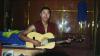 (c) Copyright - Raphael Kessler 2011 - Tibet - Monk playing guitar