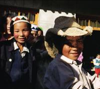 © Copyright - Raphael Kessler 2011 - China - The wild east - a kid looks better in John's hat than he ever did.