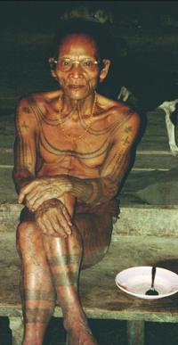 © Copyright - Raphael Kessler 2011 - Indonesia - Cleopatri Mentawai Shaman wearing my glasses