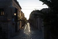 © Copyright Raphael Kessler 2012 - Italy - Sicily - Erice man walking the dog
