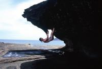 © Copyright - Raphael Kessler 2011 - Fiji - Waya Lai Lai - Erin hanging from a rock