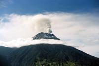 © Copyright - Raphael Kessler 2011 - Ecuador - Banos - Tungarahua volcano smoking through the clouds
